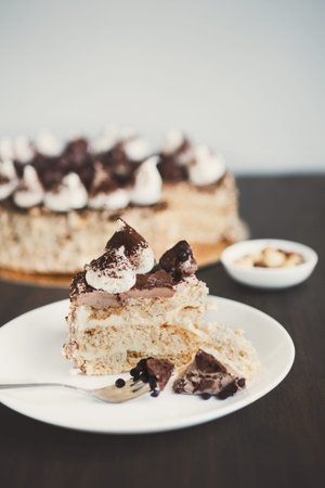 Delicious Cake Served on a Plate With Fork and Sliced Pieces