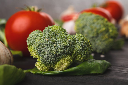 Fresh Vegetables Displayed in a Colorful Collage on a Dark Wooden Surface During Daytime