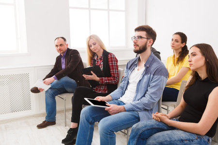 Group of People Attending a Meeting in a Bright Room During the Daytimeの写真素材