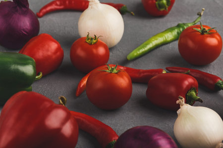 Colorful Collection of Fresh Vegetables on a Gray Background in a Vibrant Displayの写真素材