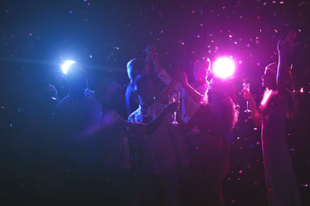 Collage of People Celebrating at a Party With Lights and Confetti in the Background