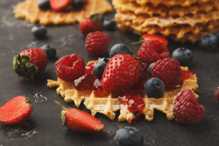 Collection of Waffles With Fresh Fruit and Jam During a Breakfast Setting