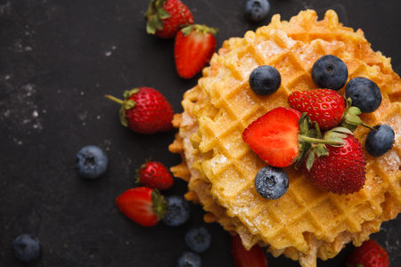 Delicious Waffle Stack With Fresh Berries on a Dark Surface