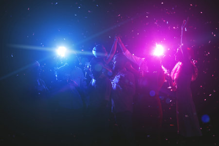 Collage of People Dancing Under Colored Lights During a Party Atmosphere at Night Event