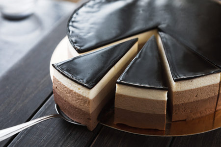 Collection of Dessert Slices on a Round Plate Showing Different Layers and Textures for Tasting