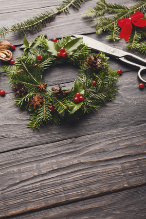 Crafting a Festive Wreath With Natural Materials and Tools for the Holiday Seasonの写真素材