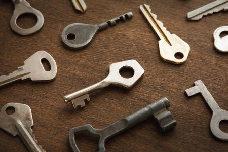 Collection of Various Keys Arranged on a Wooden Surface for Display and Study Purpose