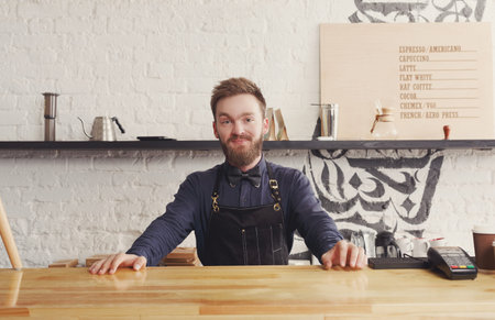 Barista Serves Coffee at a Cafe With a Modern Design in the Downtown Area During the Morning Hours