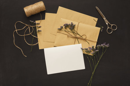 Set of Envelopes and Letters With Flowers and Twine on a Dark Background