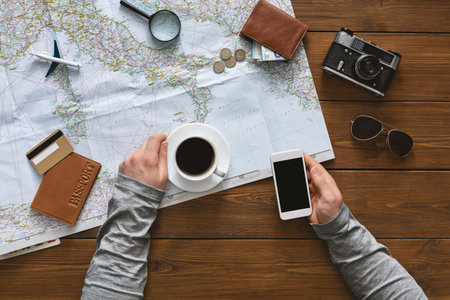 Woman drinking coffee and searching journey online