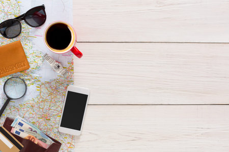 Travel Preparation on a Table With Maps, Documents, and Coffee in the Morning
