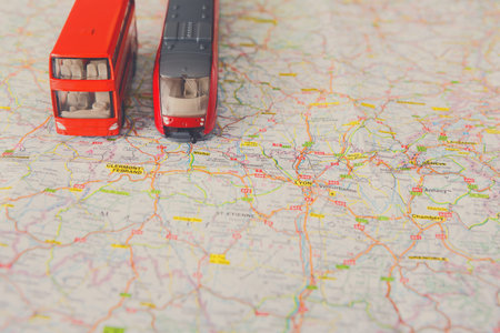 Model Vehicles on a Travel Map Showing Routes and Locations in France