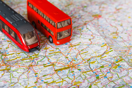 Exploring Routes With Toy Train and Bus on Map of Germany