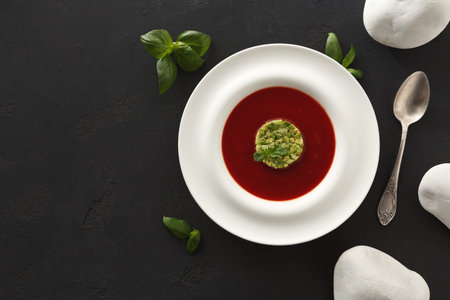 Creative Dish on a White Plate With Red Sauce and Green Garnish in a Modern Setting