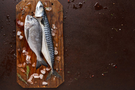 Freshly Caught Fish on a Wooden Cutting Board With Ice and Herbs Ready for Preparation