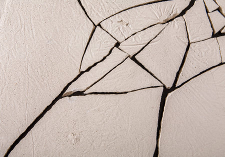 Cracked Surface With Detailed Patterns in Dry Soil at a Construction Site During Daylight