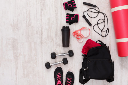 Gear and Equipment Laid out for Workout Session in Home Gym Before Exercise Starts