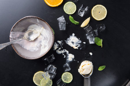 Sweet Dessert Leftovers With Citrus Slices and Ice on the Tableの写真素材