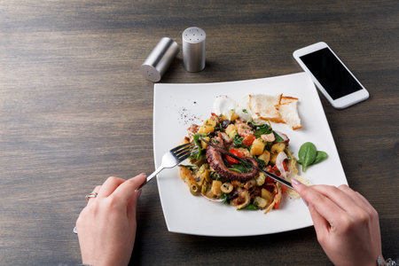 Enjoying a Meal With a Variety of Flavors and Textures at a Dining Table