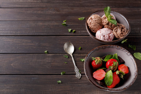 Enjoying Dessert With Ice Cream and Fresh Strawberries in a Simple Setting
