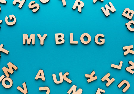 Creative Display of Wooden Letters Forming the Words My Blog on a Blue Backgroundの写真素材