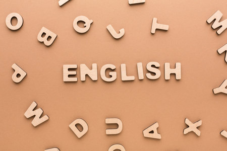 Wooden Letters Arranged on a Flat Surface With Focus on the Word English