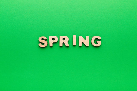 Spring Word Cutout on Green Background for Seasonal Decoration or Educational Activity