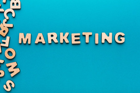 Letters Spelling Marketing on a Blue Background With Scattered Letters Aroundの写真素材