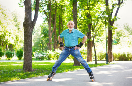 Senior Man Enjoys Inline Skating in a Park on a Sunny Day