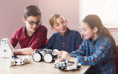 Kids Learn Robotics Skills Together While Working on Projects in a Classroom Setting