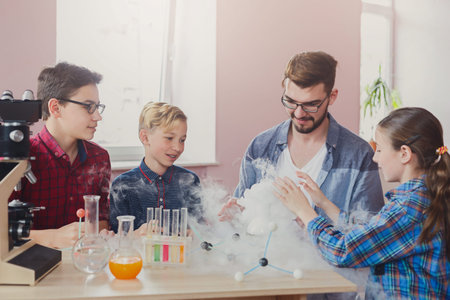 Students Conduct Science Experiment With Smoke Effects in Classroom Setting