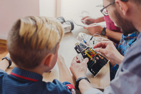 Learning About Robotics With Hands-On Activity in a Workshop for Children and Adults