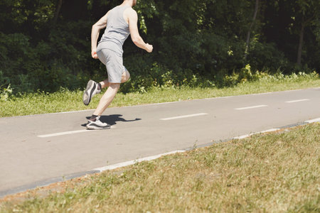 Running on a Path in a Park During Daylight Hours in Warm Weather