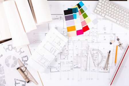 Collage of Design Materials and Tools on a Table for an Architectural Project