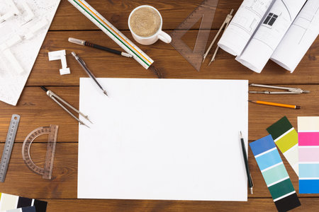 Collage of Art Tools and Materials on a Wooden Table for Architectural Design Projects