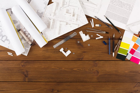 Collage of Design Materials and Tools on a Wooden Table for a Creative Project
