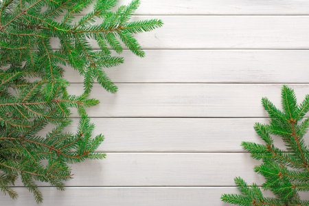 Decorative Collage of Evergreen Branches on a Wooden Surface in a Stylish Arrangement