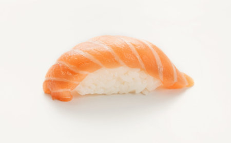 Sushi With Salmon on White Plate Served in Restaurant During Lunchtimeの写真素材