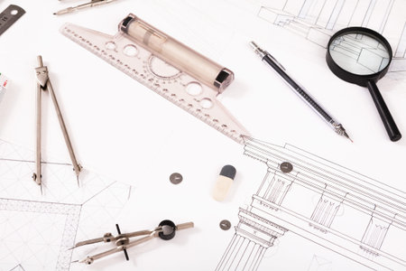 Collection of Tools and Sketches for Architectural Design and Drafting Set on a Table