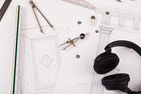 Collage of Tools and Sketches for Design Projects on Workspace Table
