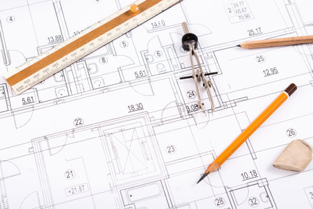 Collage of Architectural Tools and Plans on a Workspace Table in a Design Studio