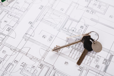 Keys Placed on a Floor Plan With Detailed Layouts and Measurements of Rooms and Spaces