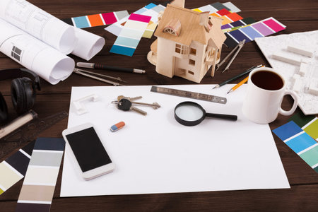 Creative Workspace for Design Projects With Tools and Materials on Wooden Table