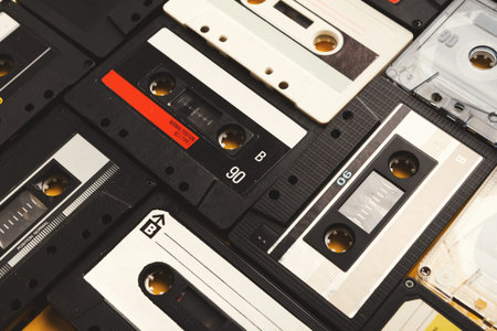 Collection of Vintage Cassette Tapes Forming a Colorful Collage Display on a Flat Surface