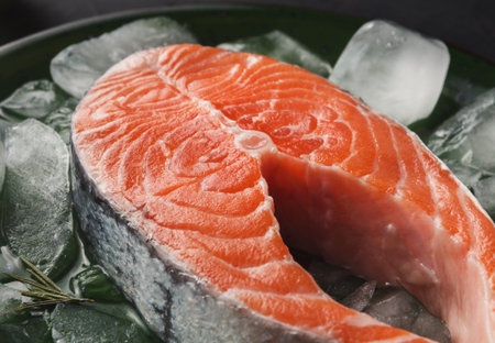 Fresh Salmon Fillet Displayed on Ice With Herbs in a Restaurant Setting for Culinary Preparation