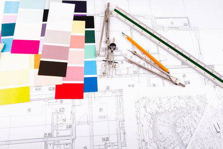 Collage of Color Swatches and Drafting Tools on Architectural Blueprints for Design Projects
