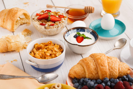 Enjoying a Breakfast Collection With Various Foods and Drinks on a Table