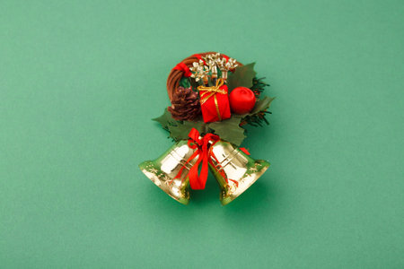 Holiday Wreath Collage With Decorative Bells and Ornaments on Green Background