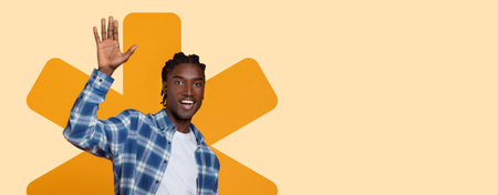 Collage of a Young Man Waving With a Background Pattern in Bright Colorsの写真素材