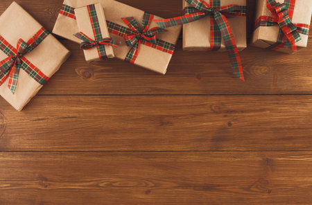 Collection of Wrapped Gifts on Wooden Surface Ready for Celebration or Special Occasion